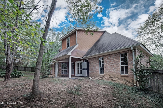 rear view of property with french doors