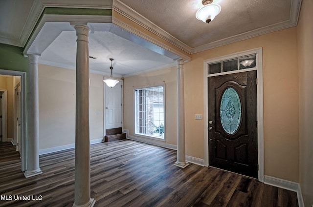 entrance foyer with decorative columns, ornamental molding, a textured ceiling, and dark hardwood / wood-style floors