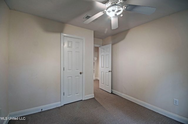 unfurnished bedroom with carpet floors and ceiling fan