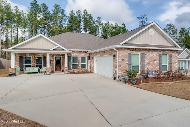 craftsman house with a garage and covered porch