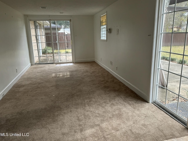 spare room with light carpet