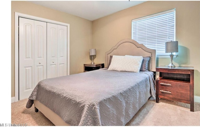 506 Loposser Ave, Gulfport, MS 39507 - bedroom featuring carpet floors, a closet, and baseboards