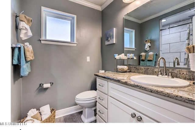 506 Loposser Ave, Gulfport, MS 39507 - bathroom featuring toilet, baseboards, vanity, wood finished floors, and ornamental molding
