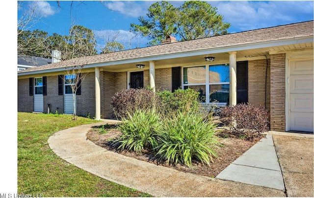 506 Loposser Ave, Gulfport, MS 39507 - view of front of property featuring brick siding, a front yard, and a porch