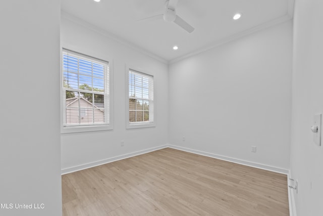 empty room with ornamental molding, a ceiling fan, light wood-style floors, baseboards, and recessed lighting