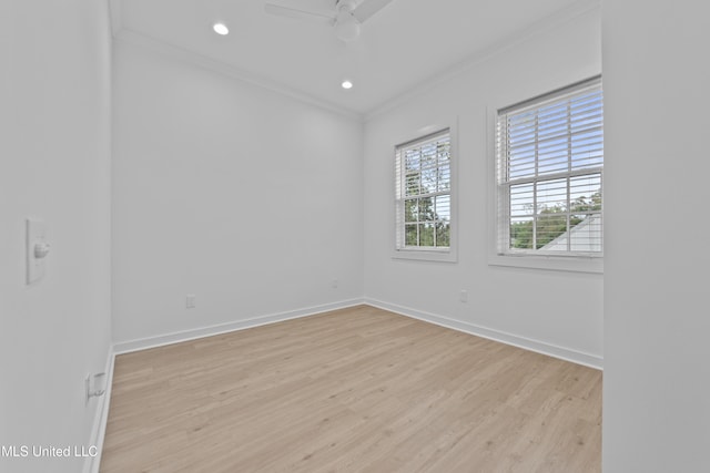 spare room with ornamental molding, light wood finished floors, baseboards, ceiling fan, and recessed lighting
