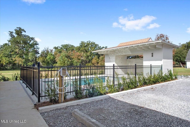 view of side of home with fence