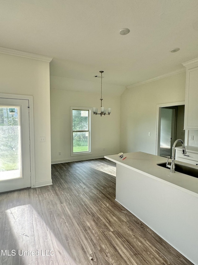 412 Baleigh Way, Canton, MS 39046 - unfurnished dining area featuring ornamental molding, wood finished floors, and a chandelier