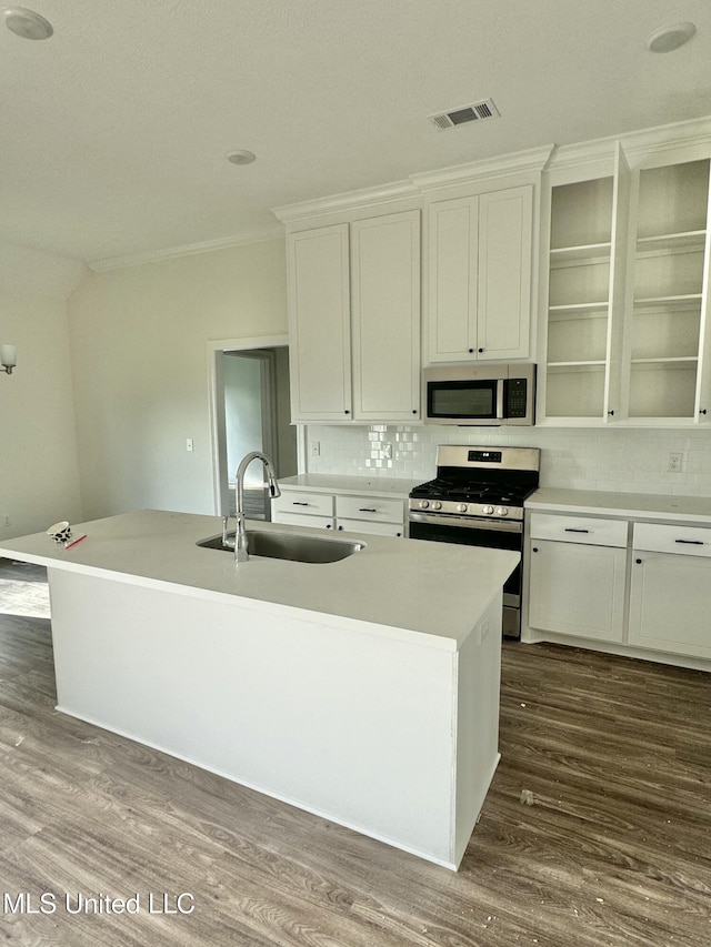 412 Baleigh Way, Canton, MS 39046 - kitchen featuring appliances with stainless steel finishes, tasteful backsplash, dark wood-type flooring, white cabinetry, and ornamental molding
