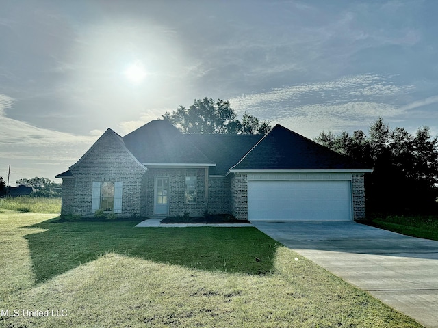 412 Baleigh Way, Canton, MS 39046 - view of front of house with an attached garage, a front lawn, driveway, and brick siding