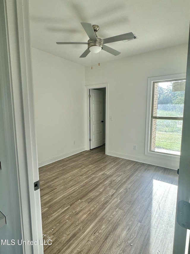 412 Baleigh Way, Canton, MS 39046 - empty room featuring ceiling fan and wood finished floors