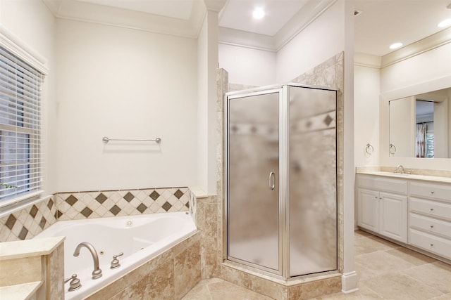 bathroom featuring tile patterned floors, vanity, ornamental molding, and plus walk in shower