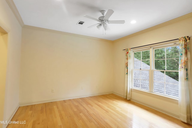 spare room with light hardwood / wood-style floors, ceiling fan, and crown molding