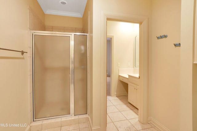 bathroom with tile patterned flooring, vanity, crown molding, and a shower with shower door