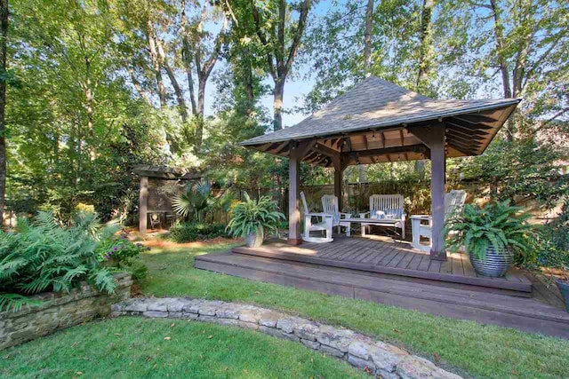 exterior space with a gazebo and a lawn