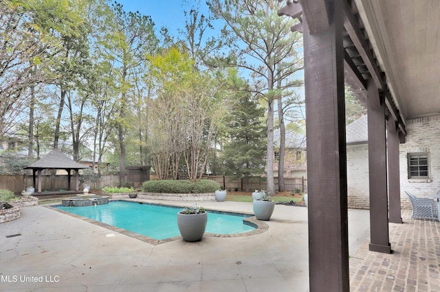 view of swimming pool with a gazebo and a patio area