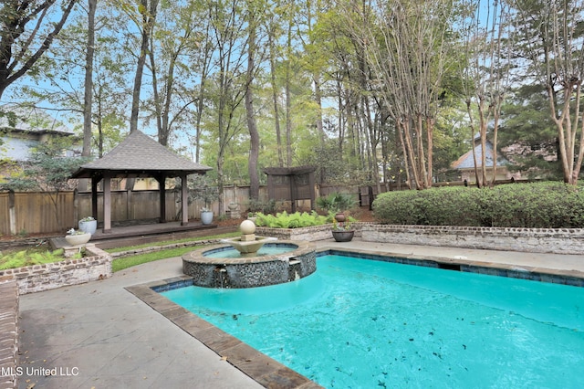 view of pool featuring an in ground hot tub and a gazebo