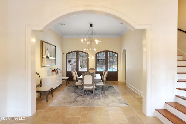 dining space featuring an inviting chandelier and ornamental molding