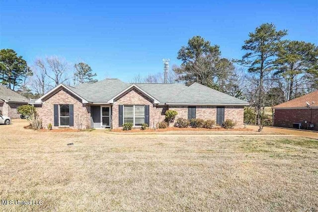 ranch-style house with brick siding and a front lawn