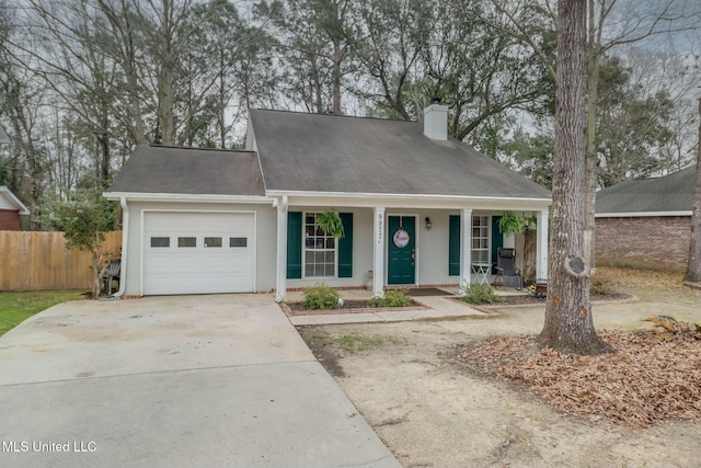 view of front of house featuring fence, a porch, concrete driveway, a chimney, and a garage