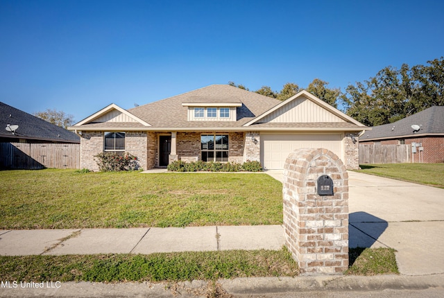 view of front facade with concrete driveway, fence, brick siding, and a front yard