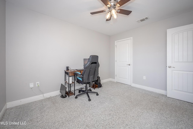 office area with baseboards, carpet, visible vents, and ceiling fan