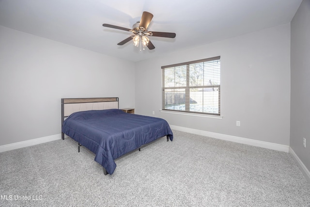 bedroom featuring carpet flooring, a ceiling fan, and baseboards