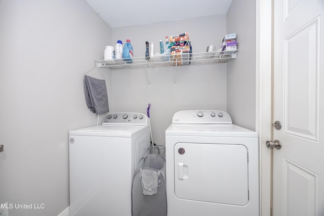 laundry room with laundry area and washing machine and clothes dryer