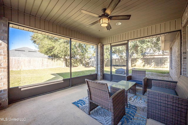 sunroom / solarium featuring wood ceiling and ceiling fan