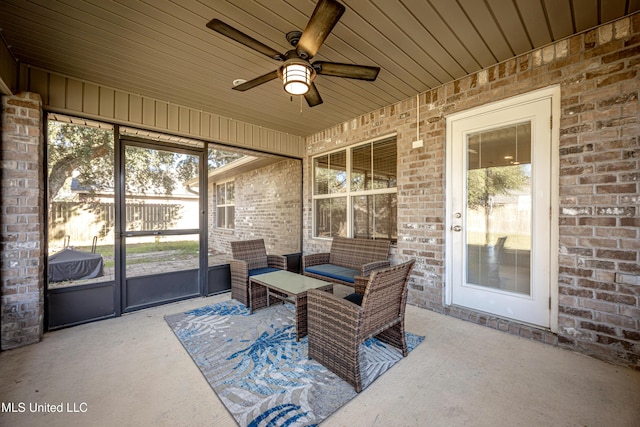 sunroom / solarium with a ceiling fan