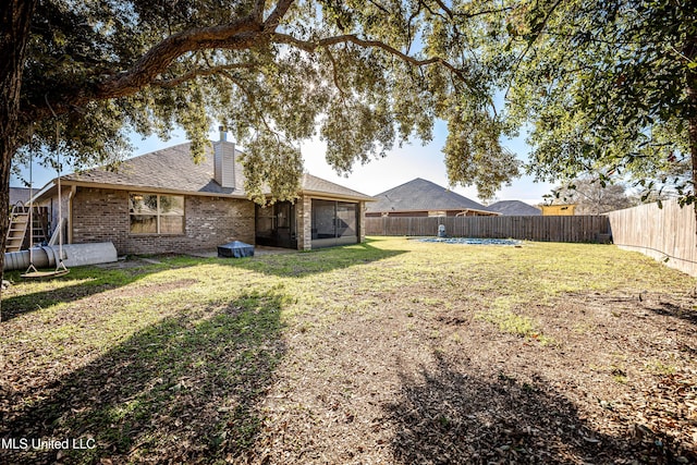 view of yard with a fenced backyard