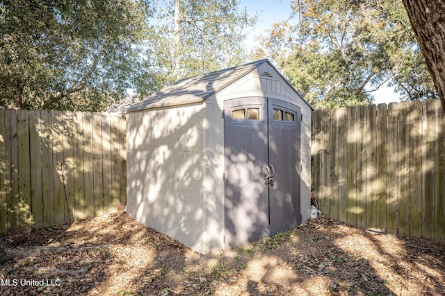 view of shed featuring a fenced backyard