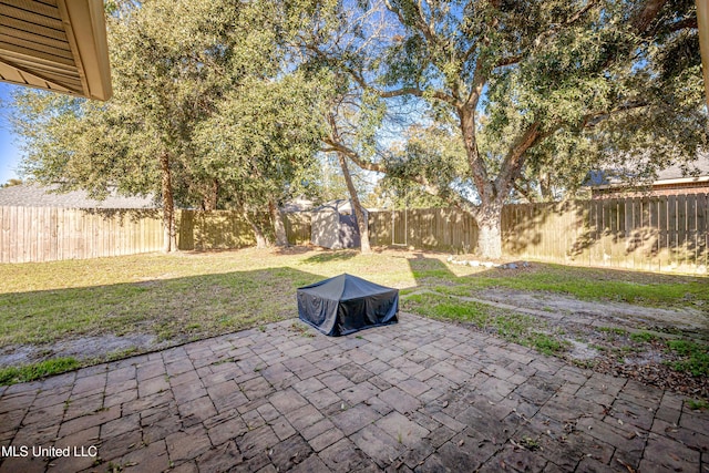 view of patio / terrace featuring an outbuilding and a fenced backyard