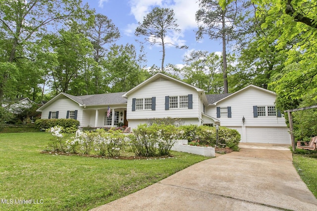 split level home featuring a garage and a front yard