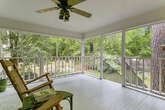 sunroom featuring ceiling fan