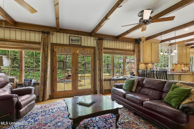 living room with hardwood / wood-style flooring, ceiling fan, french doors, and beamed ceiling