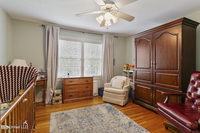 sitting room featuring ceiling fan and light hardwood / wood-style flooring