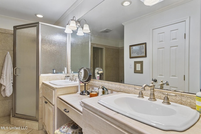 bathroom with vanity, a notable chandelier, ornamental molding, tile patterned floors, and walk in shower