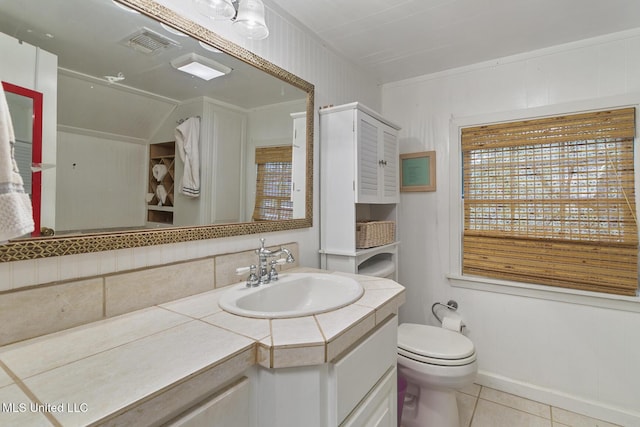 bathroom featuring tile patterned floors, toilet, and vanity