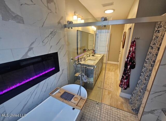 bathroom with vanity and a fireplace