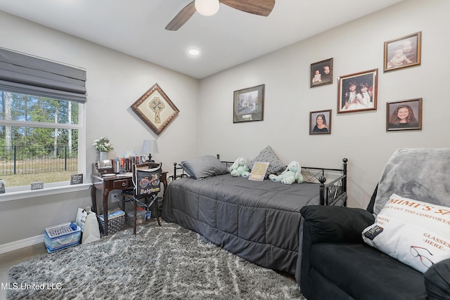 bedroom with hardwood / wood-style floors and ceiling fan