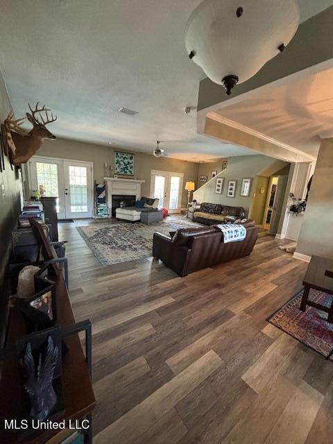 living room featuring french doors and wood-type flooring