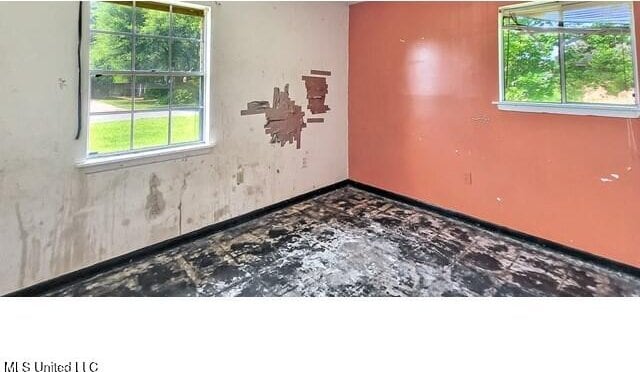 205 Shalimar Dr, Long Beach, MS 39560 - spare room featuring baseboards