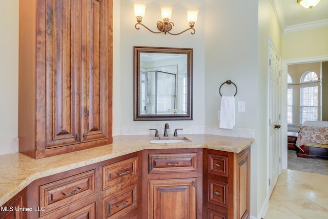 bathroom with crown molding, vanity, and tile patterned flooring