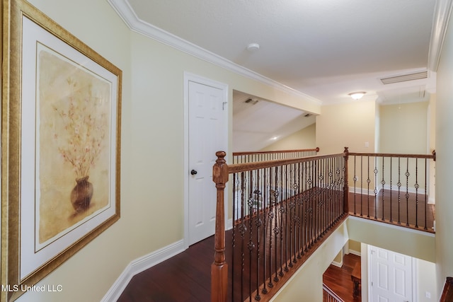 hallway featuring crown molding and hardwood / wood-style flooring