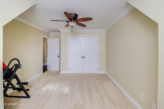 interior space featuring light carpet and ceiling fan