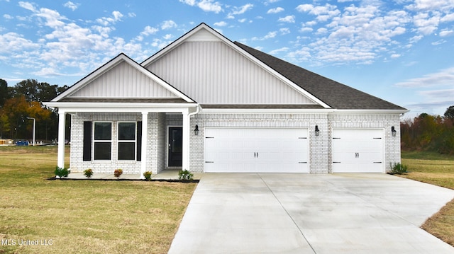 view of front of home featuring a garage and a front yard