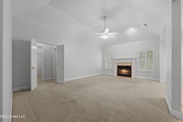 725 Old Savannah Dr, Long Beach, MS 39560 - unfurnished living room with ceiling fan, light carpet, a tile fireplace, baseboards, and high vaulted ceiling