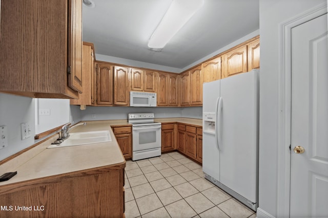 725 Old Savannah Dr, Long Beach, MS 39560 - kitchen featuring white appliances, a sink, light tile patterned floors, light countertops, and brown cabinetry