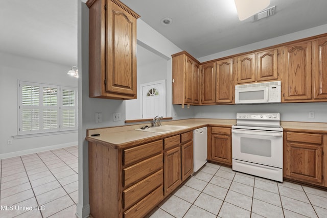 725 Old Savannah Dr, Long Beach, MS 39560 - kitchen with white appliances, a sink, light tile patterned flooring, and light countertops